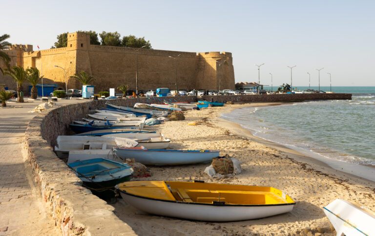 Hammamet promenade with fortified Kasbah and fishing boats, Tunisia