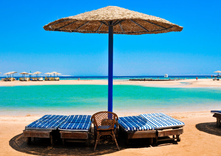 Straw umbrellas on the beach of Egypt